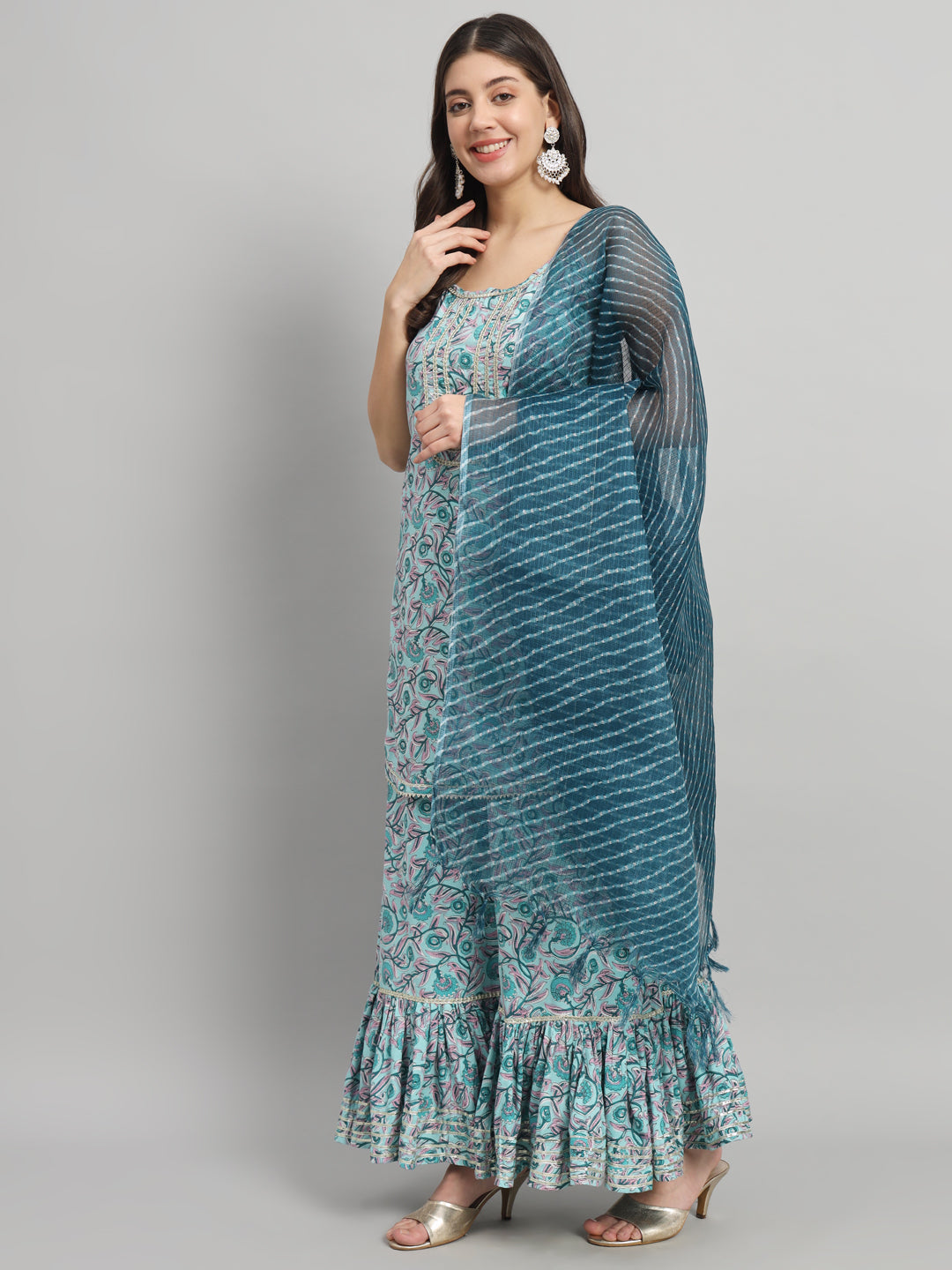 Woman in a printed maternity dress with ruffle hem and blue dupatta, stylish pregnancy outfit