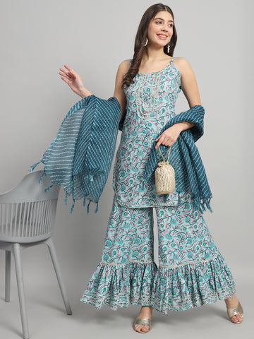 Woman in teal printed ethnic maternity palazzo suit with dupatta and pearl jewelry