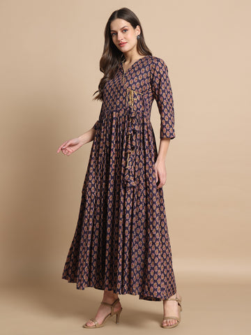 Woman wearing a printed maternity maxi dress with three-quarter sleeves and V-neck design