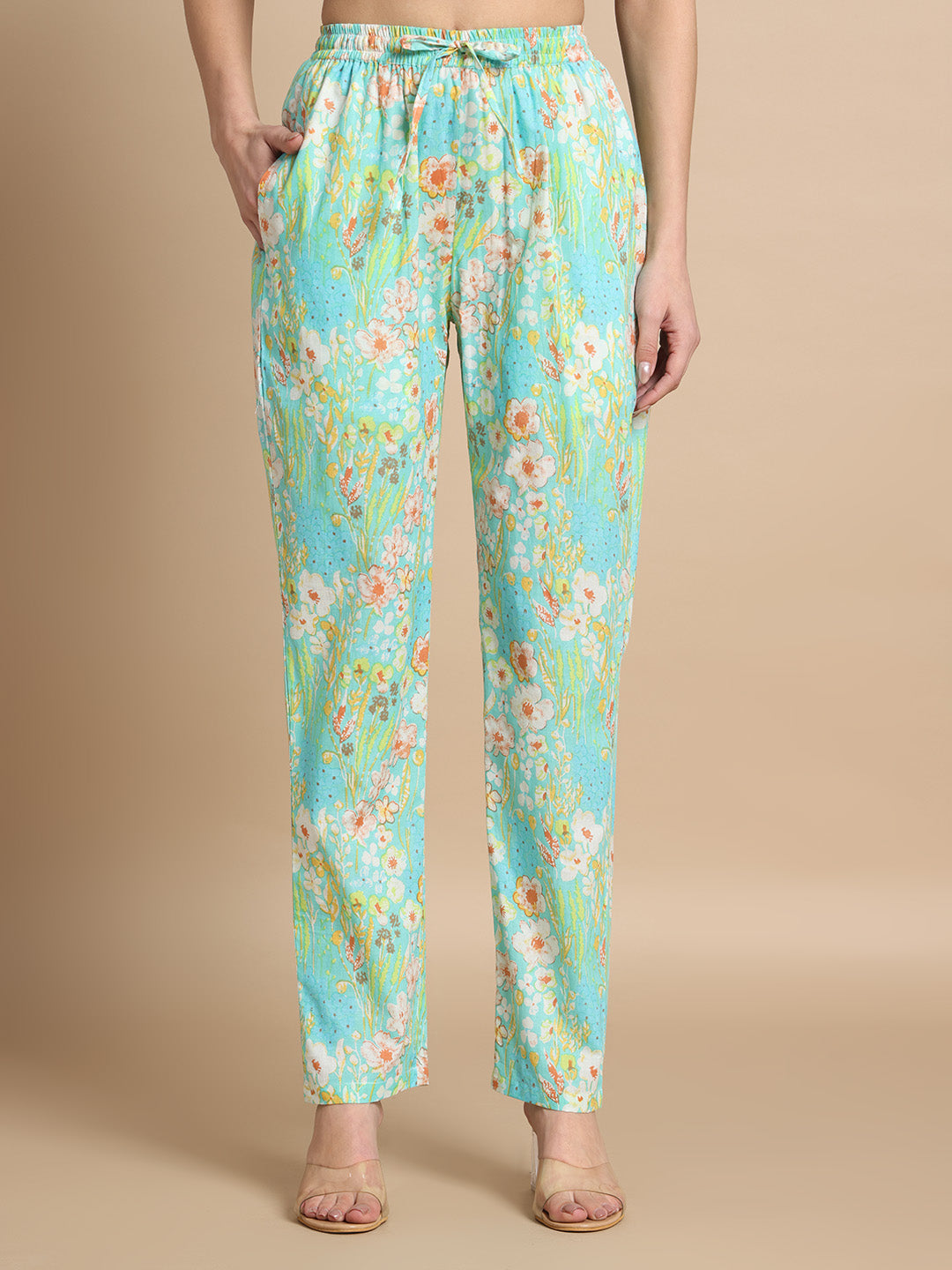 Blue floral print maternity pants with pockets and drawstring waist, front view