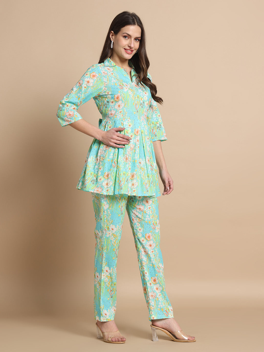 Woman in light blue floral maternity kurta and pants set with three-quarter sleeves