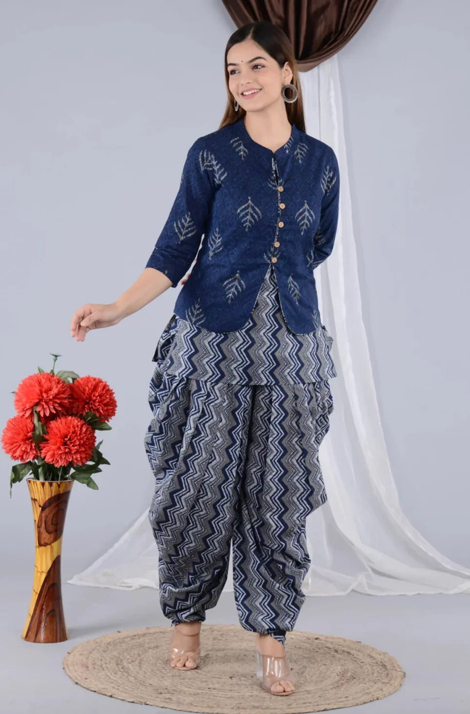 Woman wearing a blue printed maternity kurta set with zigzag patterned dhoti pants
