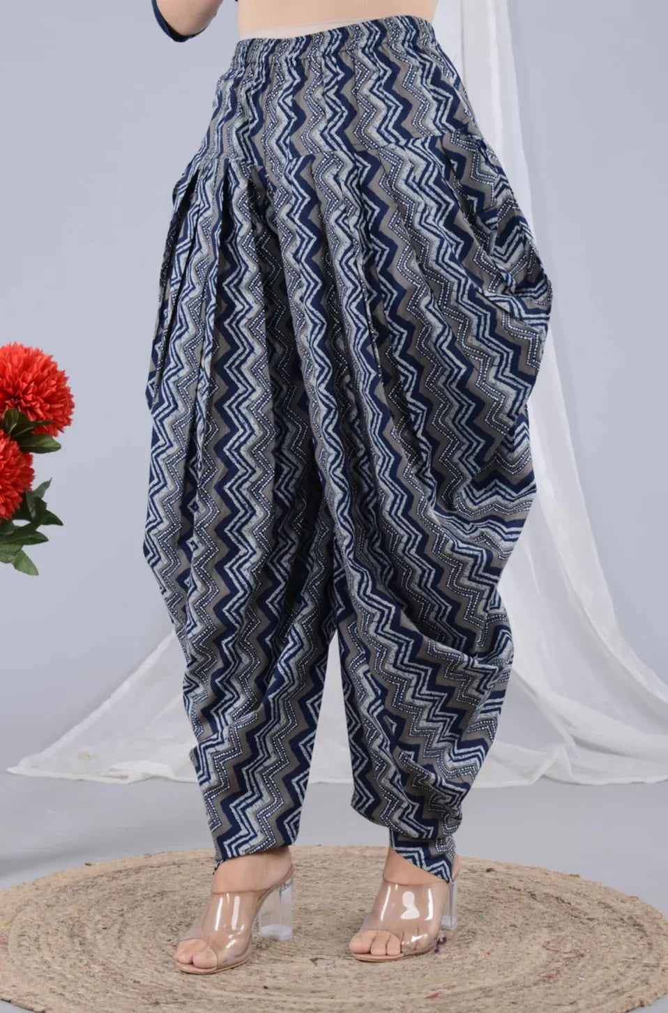 Woman wearing blue zigzag print dhoti pants, maternity-friendly, with clear heels